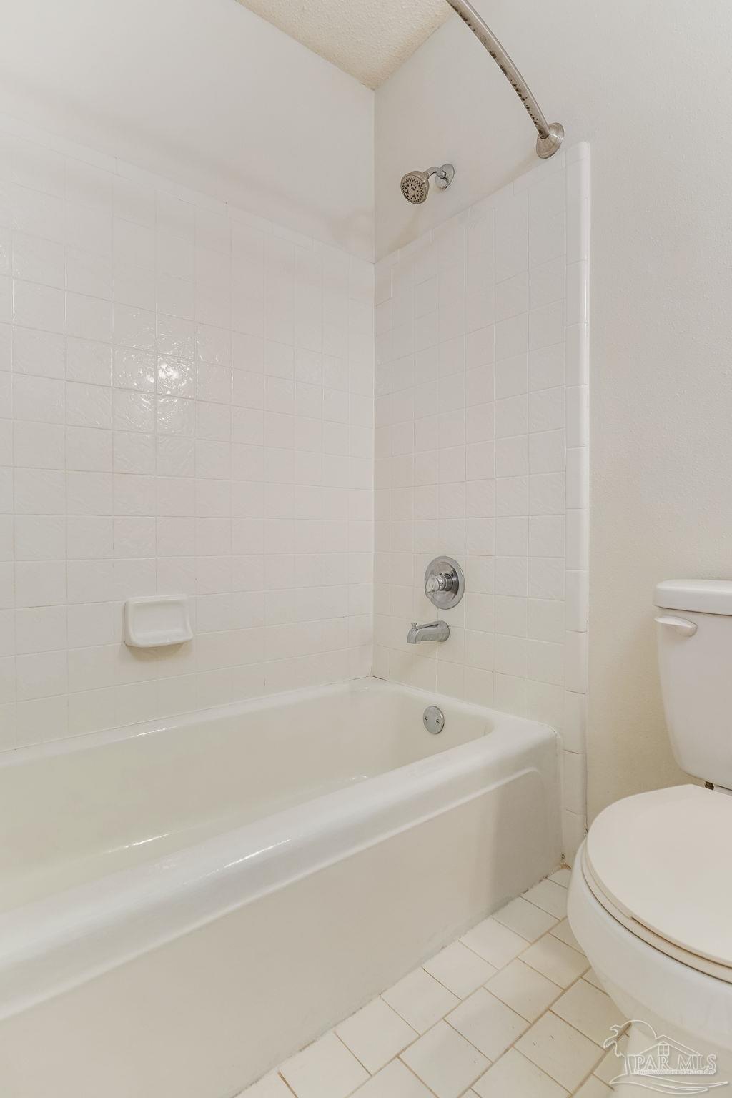 1422 Starlight Drive Cantonment, FL 32533 - Photo 25 of 49 a white bath tub sitting next to a white toilet