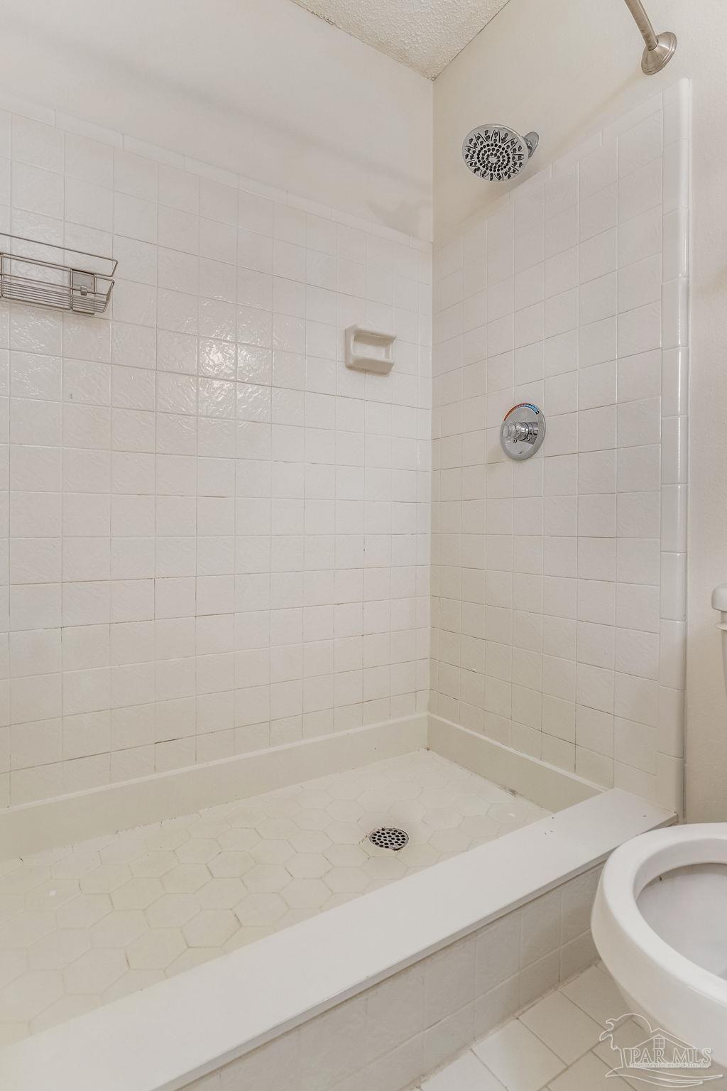 1422 Starlight Drive Cantonment, FL 32533 - Photo 32 of 49 a bathroom with a shower and a bathtub