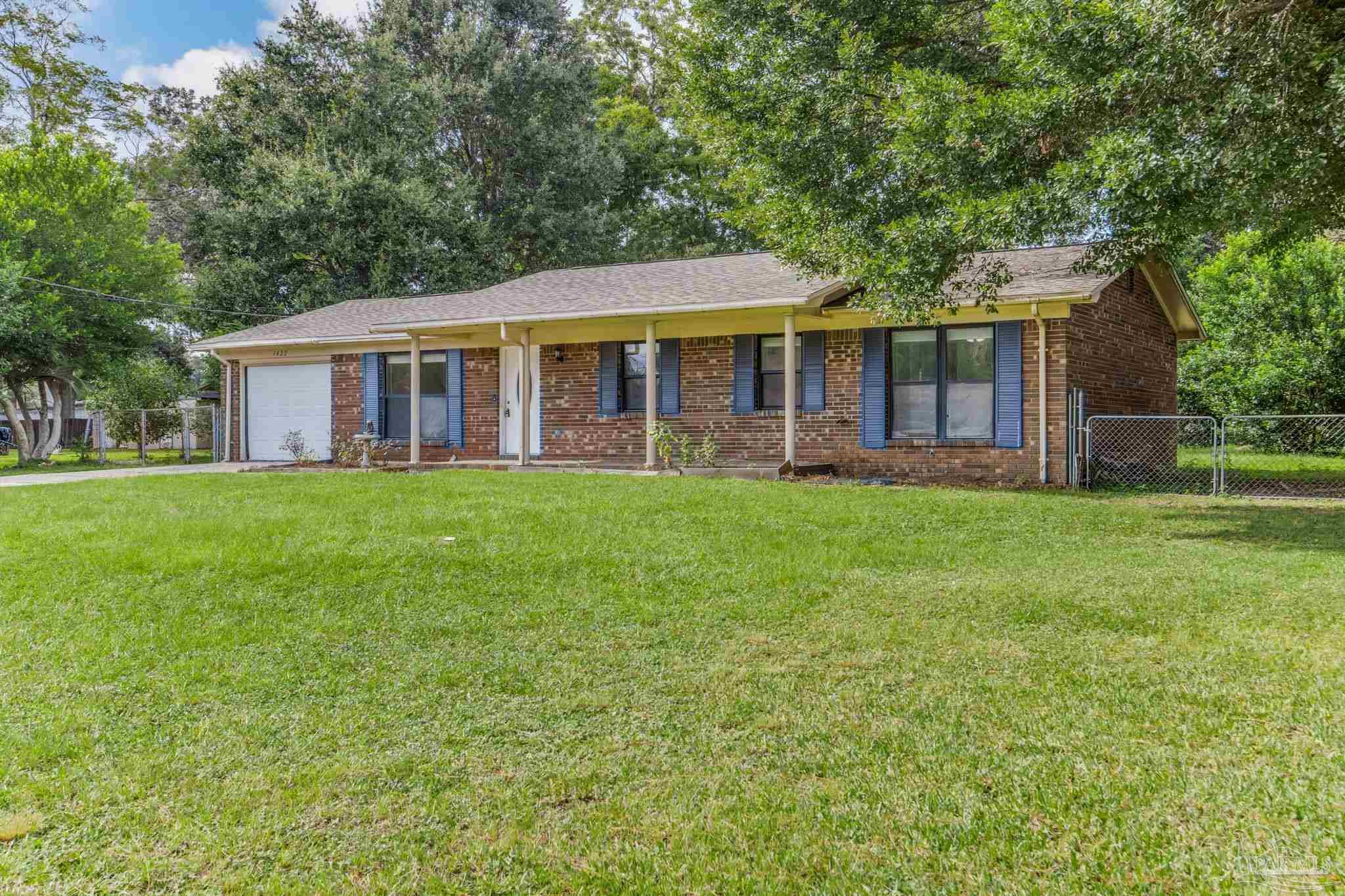 1422 Starlight Drive Cantonment, FL 32533 - Photo 39 of 49 a view of a house with a yard and sitting area