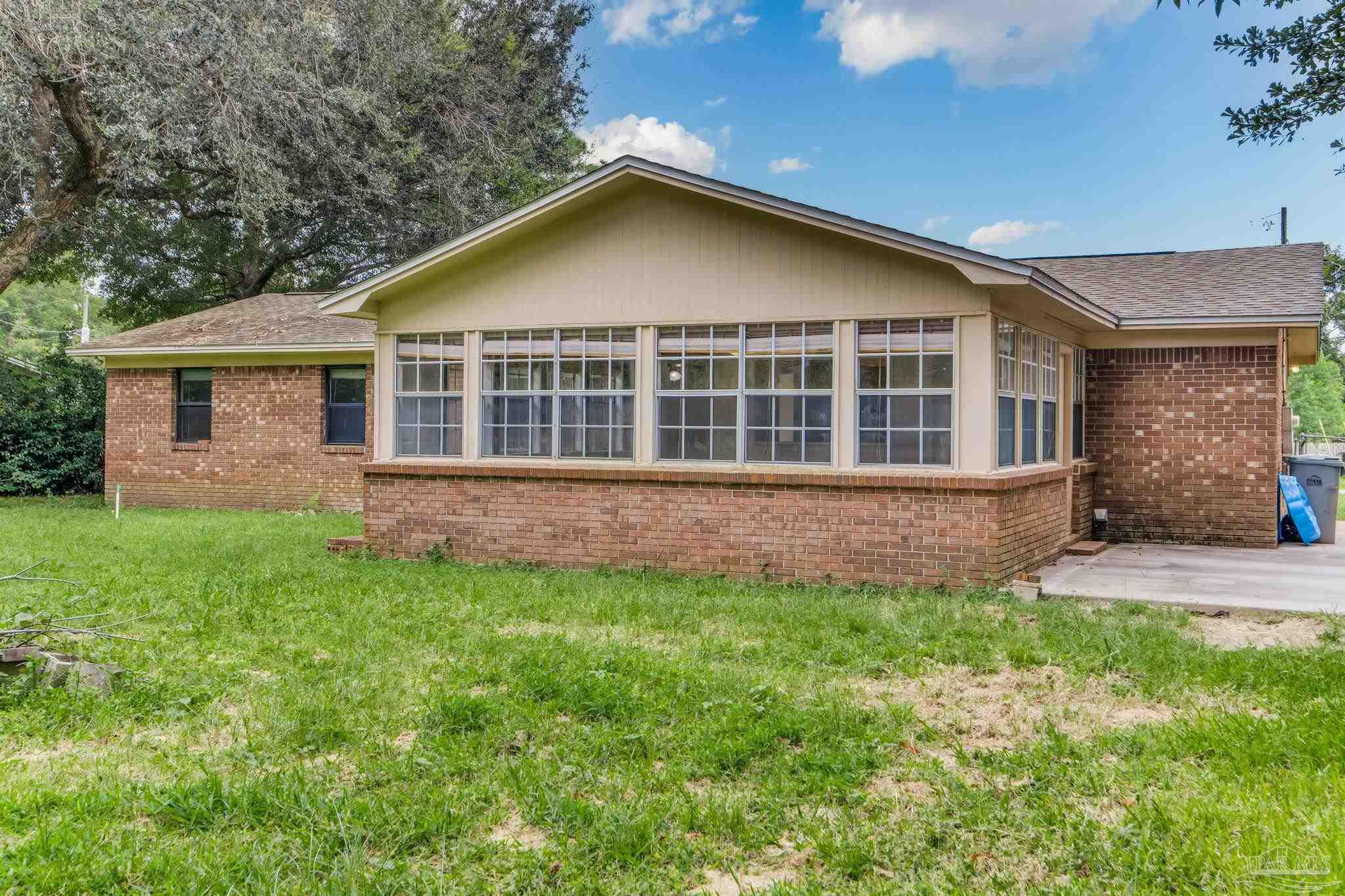 1422 Starlight Drive Cantonment, FL 32533 - Photo 42 of 49 front view of a house with a yard