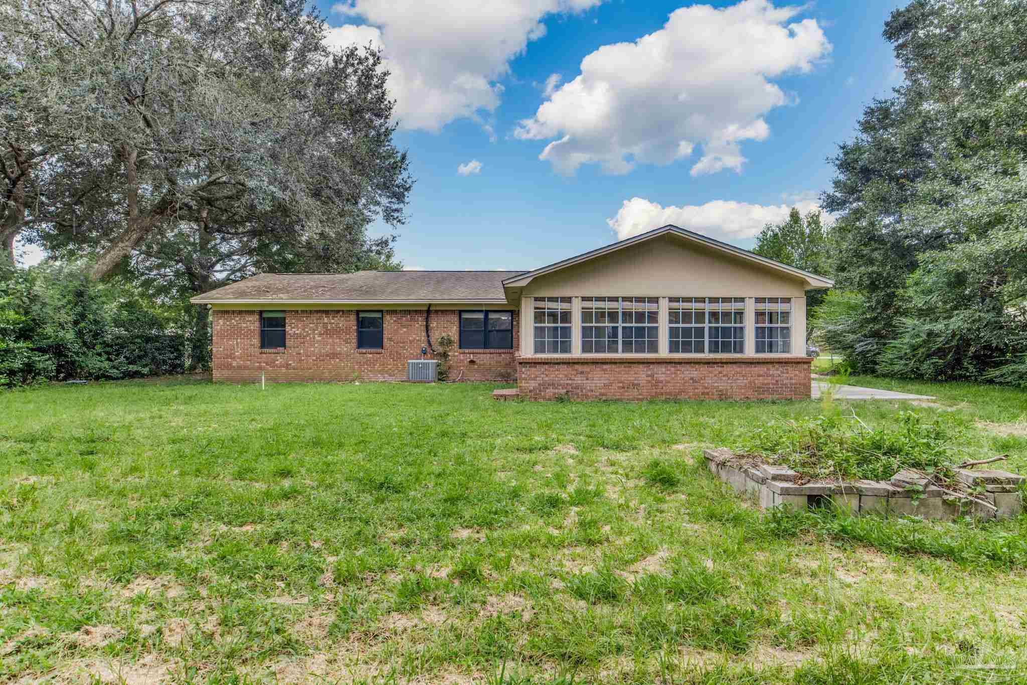 1422 Starlight Drive Cantonment, FL 32533 - Photo 43 of 49 a view of house with yard and entertaining space