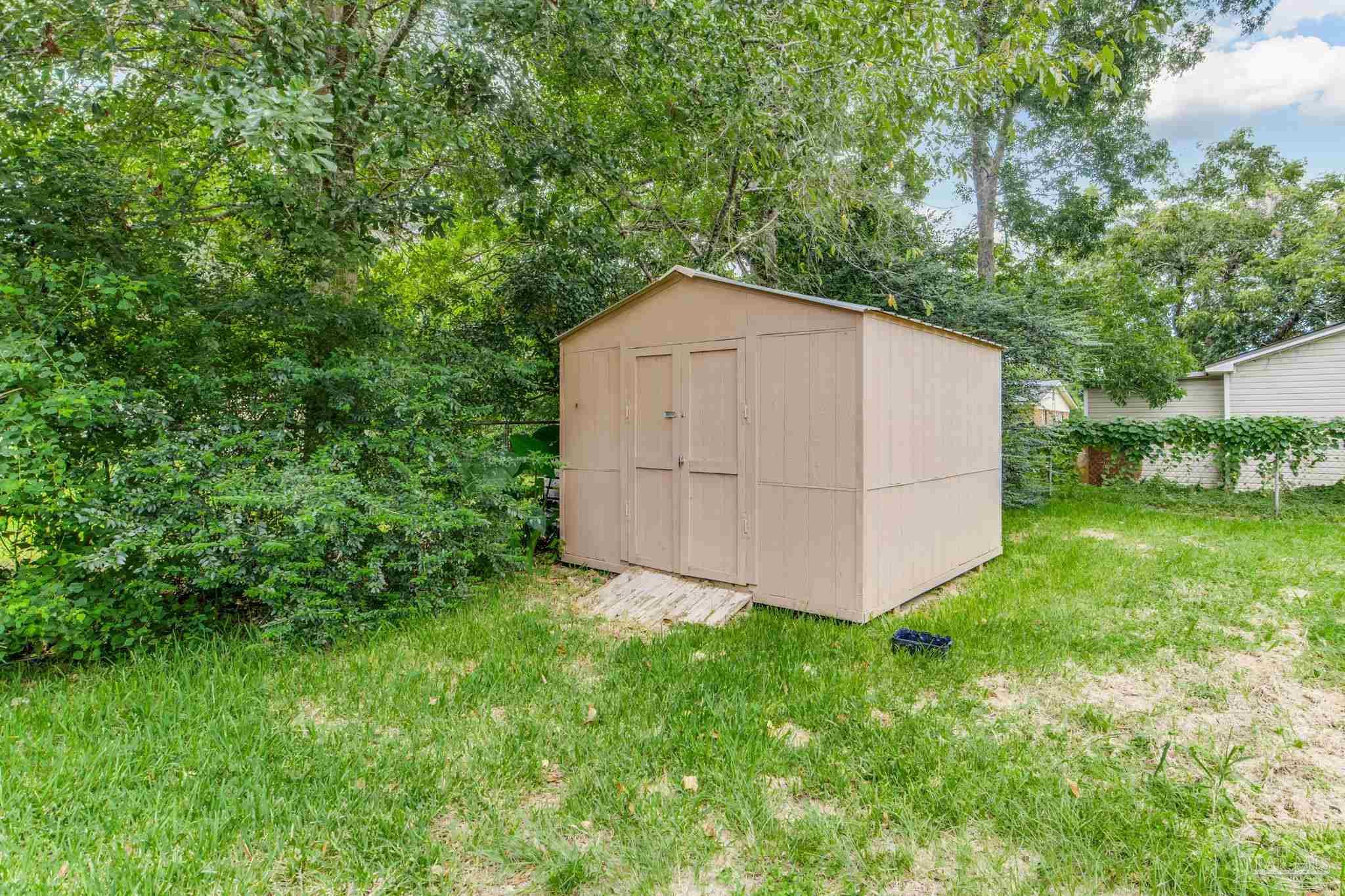 1422 Starlight Drive Cantonment, FL 32533 - Photo 45 of 49 a view of backyard with garden and trees