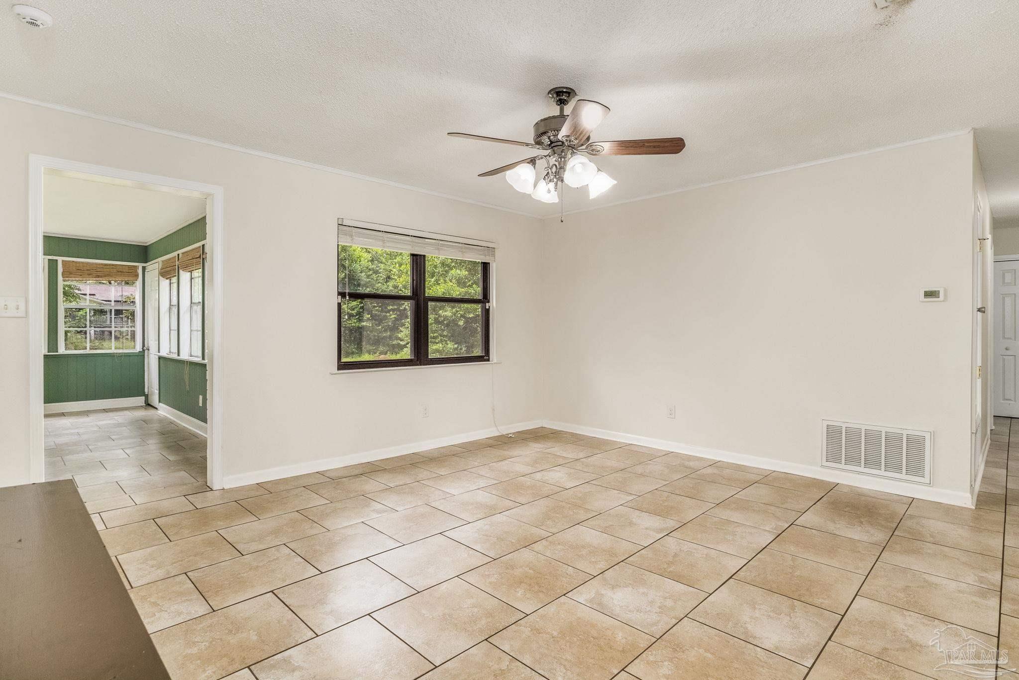 1422 Starlight Drive Cantonment, FL 32533 - Photo 5 of 49 a view of an empty room with a window