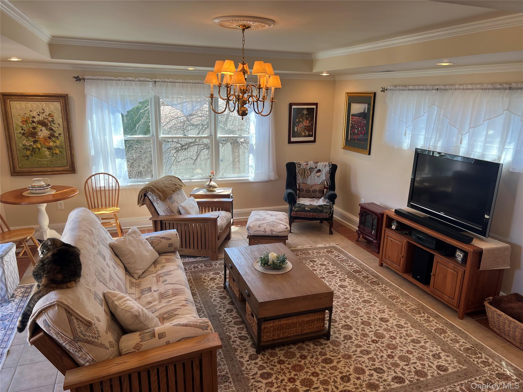 7 Pulaski Road, Unit 7 Fishkill, NY 12524 - Photo 11 of 38 Sunken living room with tray ceiling and sliding glass doors to private back deck