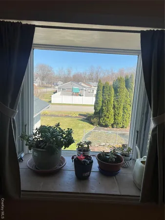 a bathroom with a shower sink and mirror