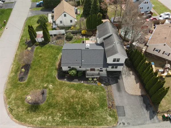 a view of a dining room with furniture a chandelier and wooden floor