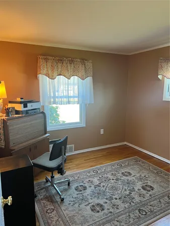 a living room with a bed