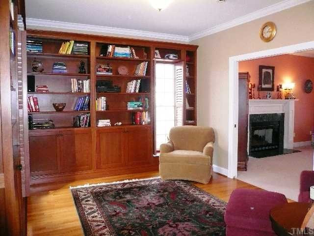 5908 Orchid Valley Road Raleigh, NC 27613 - Photo 6 of 12 The study is gorgeous with hardwood floors, custom built in shelves and cabinets plus plantation blinds. Perfect for a home office or music room! Studio/Study/Office