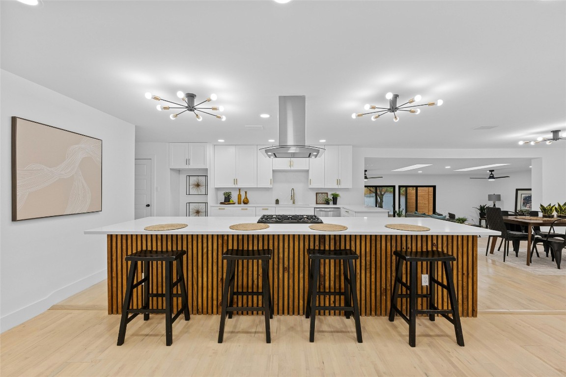 1305 Ridgehaven Drive Austin, TX 78723 - Photo 14 of 40 a large kitchen with a table and chairs