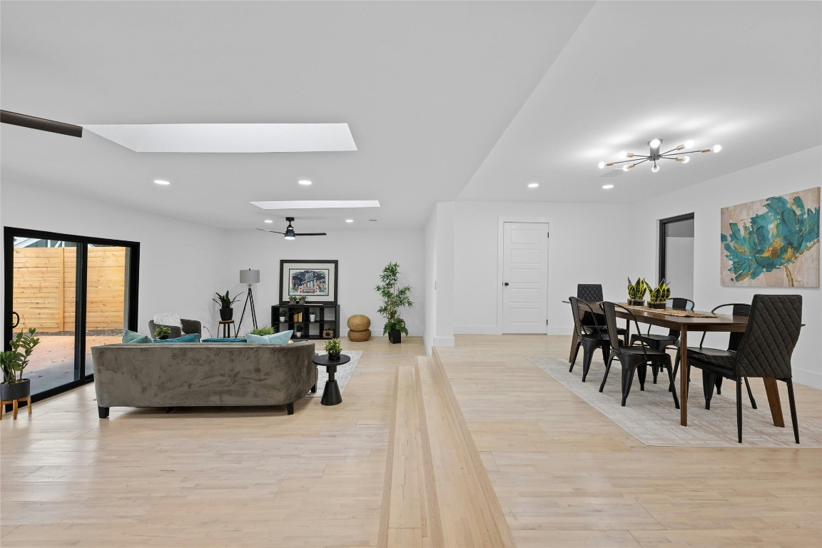 1305 Ridgehaven Drive Austin, TX 78723 - Photo 16 of 40 a view of a dining room with furniture window and wooden floor