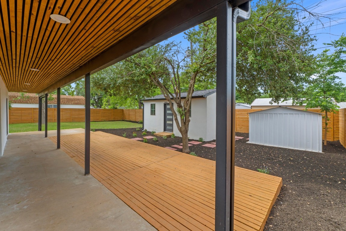 1305 Ridgehaven Drive Austin, TX 78723 - Photo 32 of 40 a view of a house with backyard and a tree