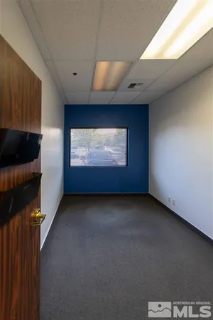 a view of hallway with wooden floor