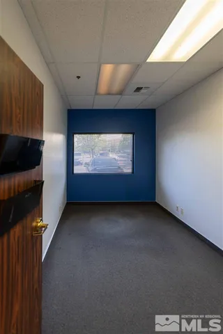 a view of hallway with wooden floor