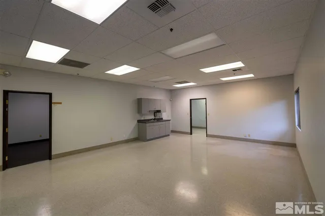 a kitchen with stainless steel appliances granite countertop a sink a stove and cabinets