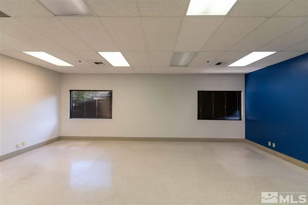 a view of a livingroom and a fireplace