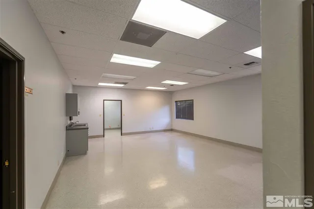 a view of hallway with bathroom