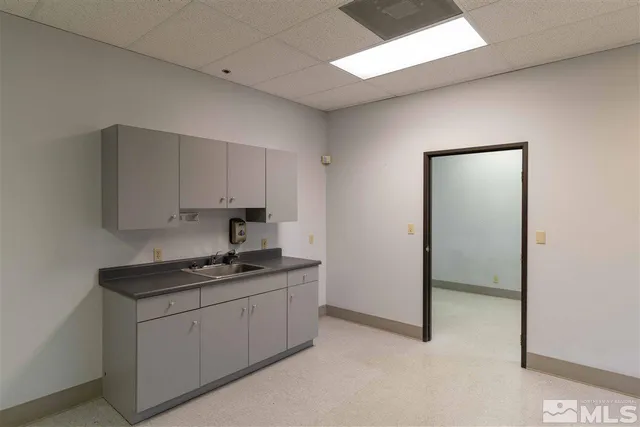 a living room with a fireplace and a window