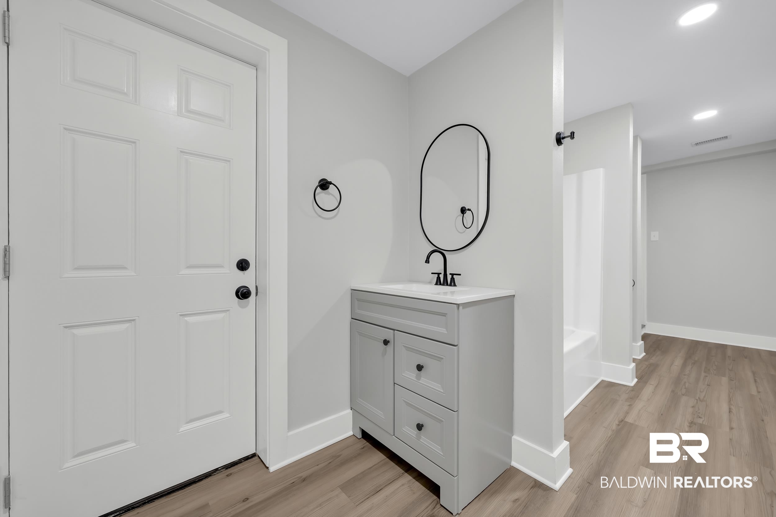 8351 Theodore Dawes Road Theodore, AL 36582 - Photo 21 of 46 Bathroom featuring vanity, light wood finished floors, and recessed lighting