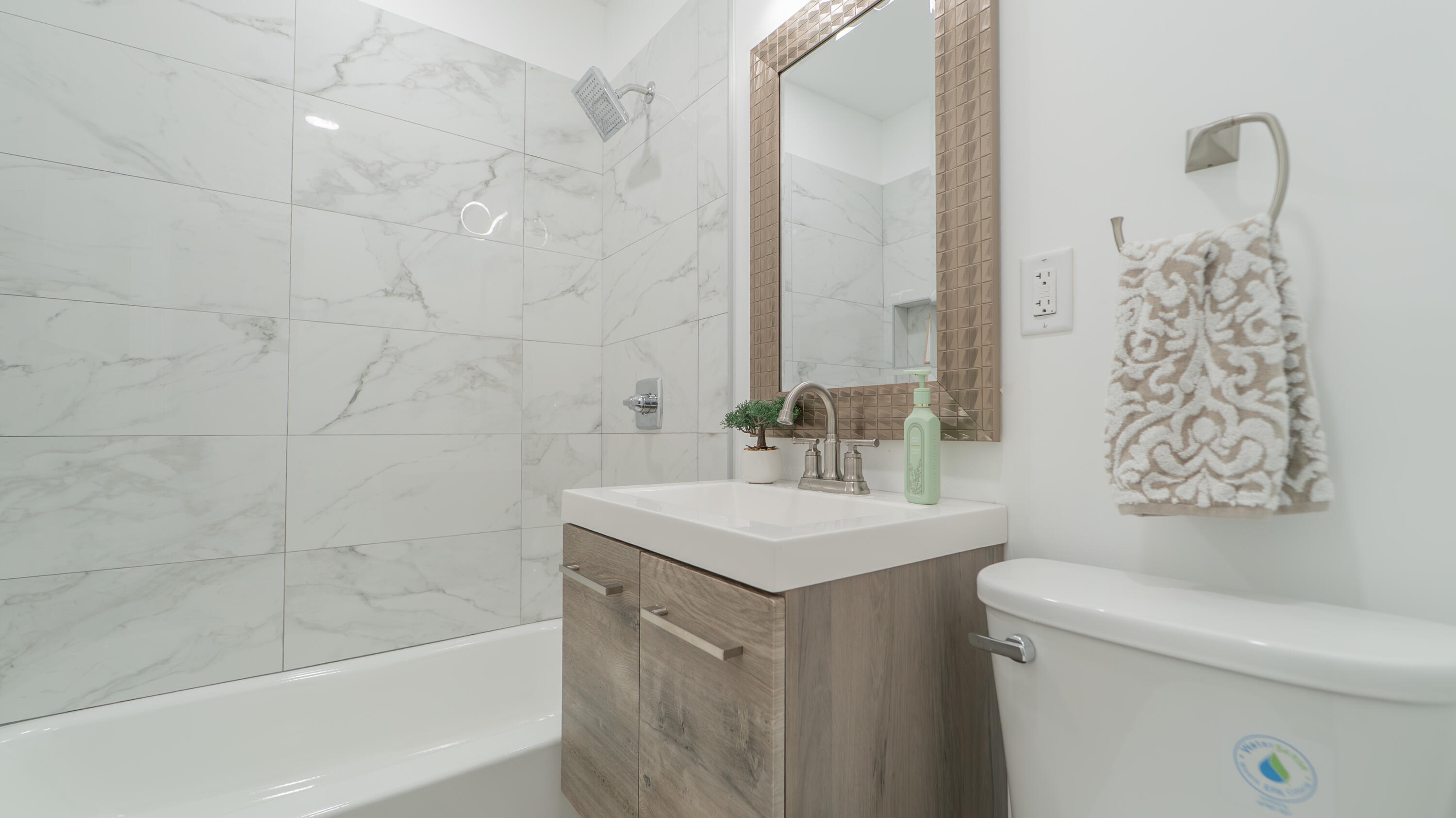 855 Fayette Street Gary, IN 46403 - Photo 13 of 25 a bathroom with a sink a toilet and shower