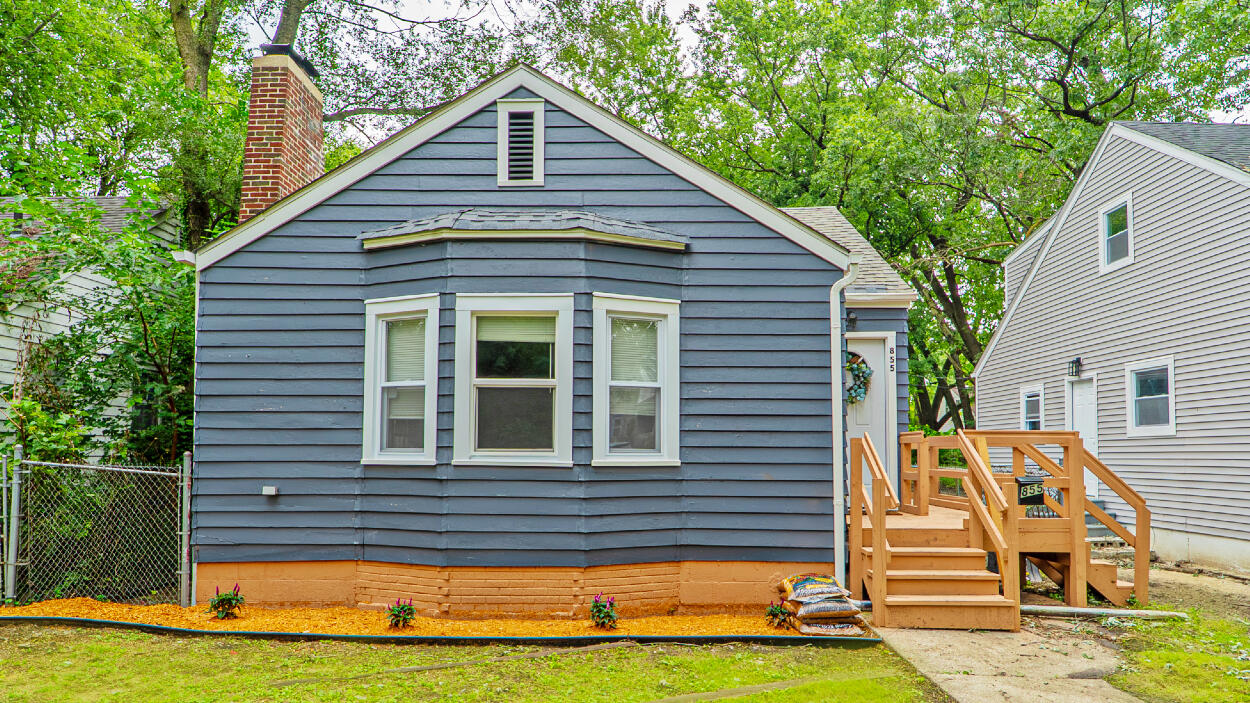 855 Fayette Street Gary, IN 46403 - Photo 2 of 25 a front view of a house with a yard