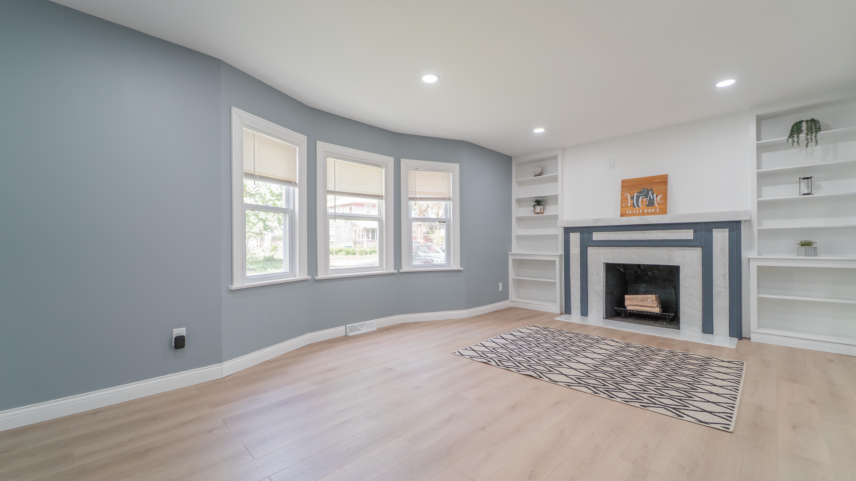 855 Fayette Street Gary, IN 46403 - Photo 4 of 25 a view of an empty room with a window and fireplace