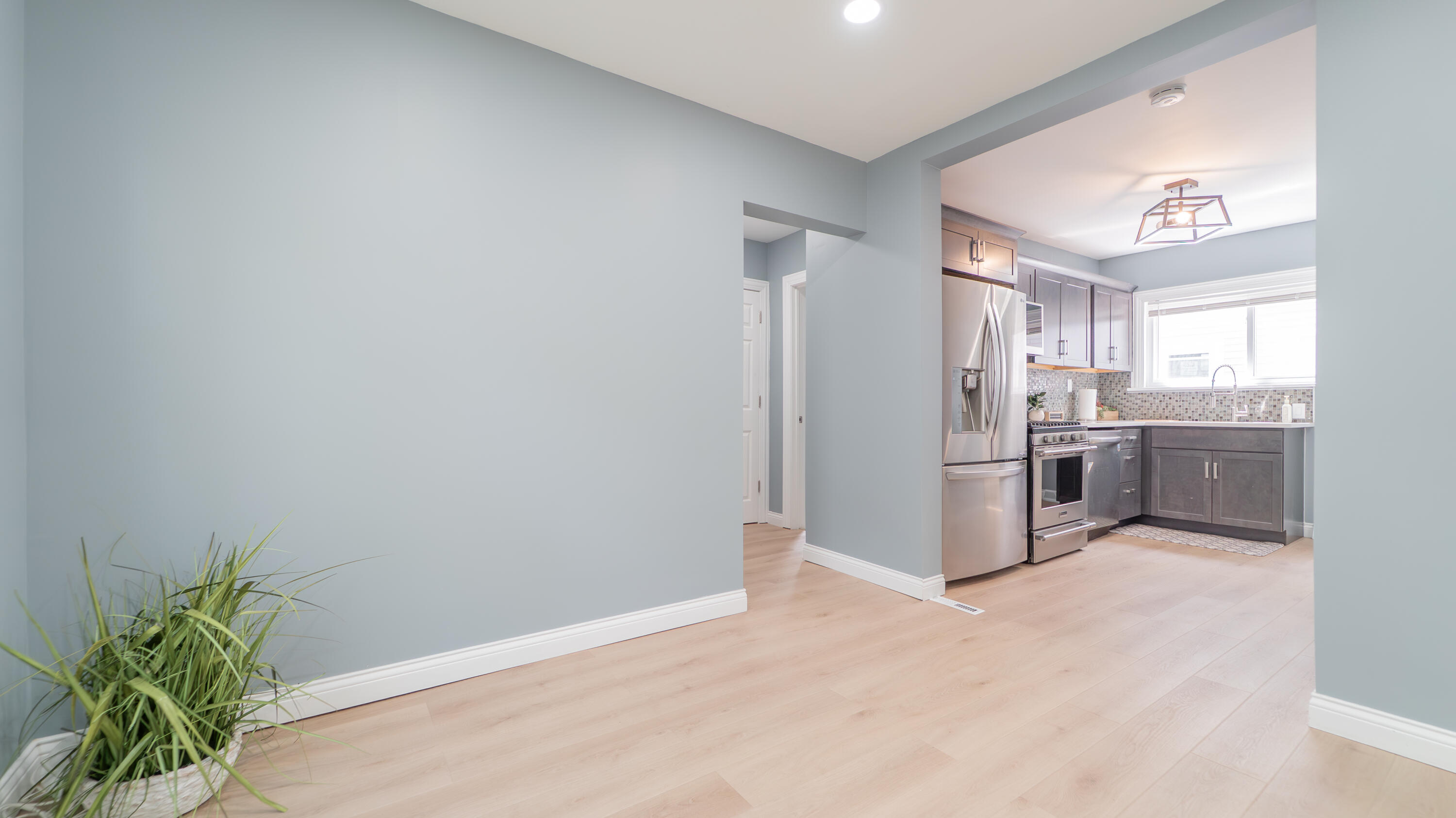 855 Fayette Street Gary, IN 46403 - Photo 7 of 25 a kitchen with stainless steel appliances a refrigerator and a sink