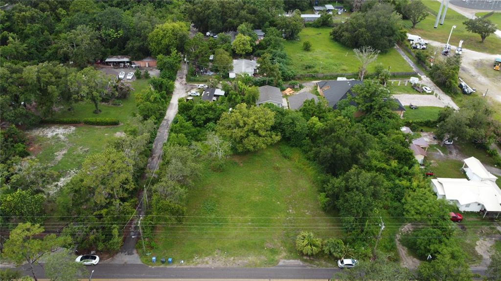 10616 Davis Road Tampa, FL 33637 - Photo 3 of 8 an aerial view of residential houses with outdoor space and trees
