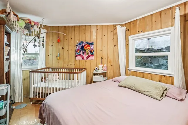 a bedroom with furniture and a window