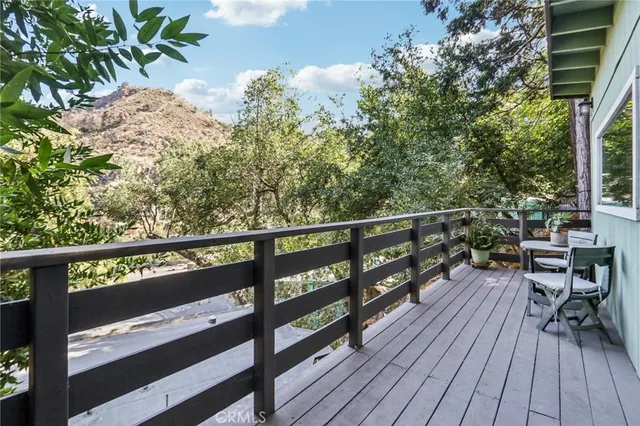a view of a city with lush green forest