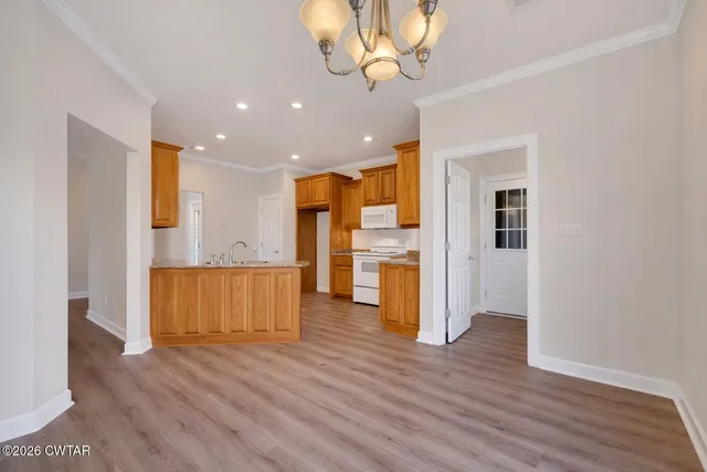a view of kitchen with wooden floor