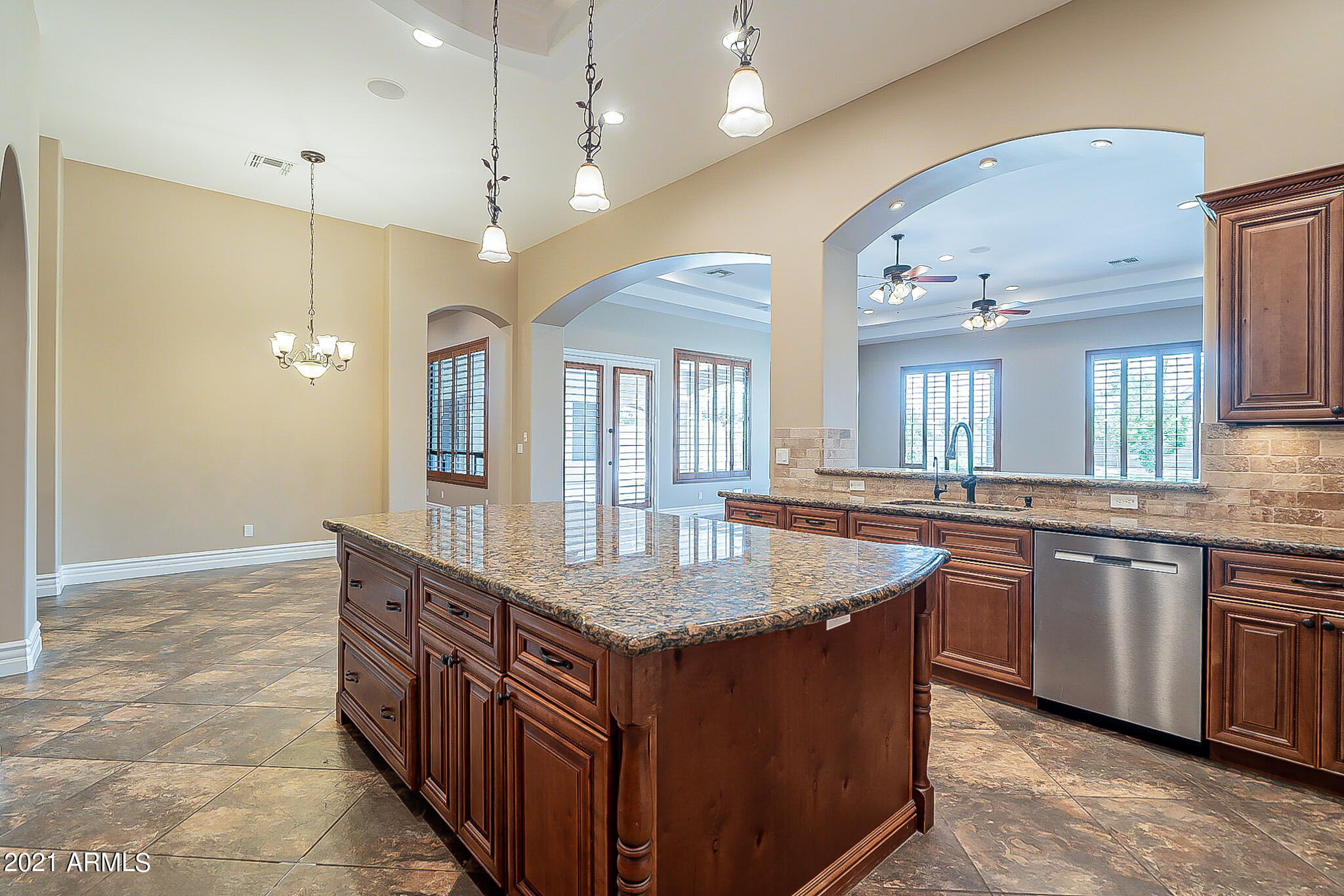 2789 East Ridgewood Lane Gilbert, AZ 85298 - Photo 13 of 60 a kitchen with granite countertop a sink a counter top space and stainless steel appliances