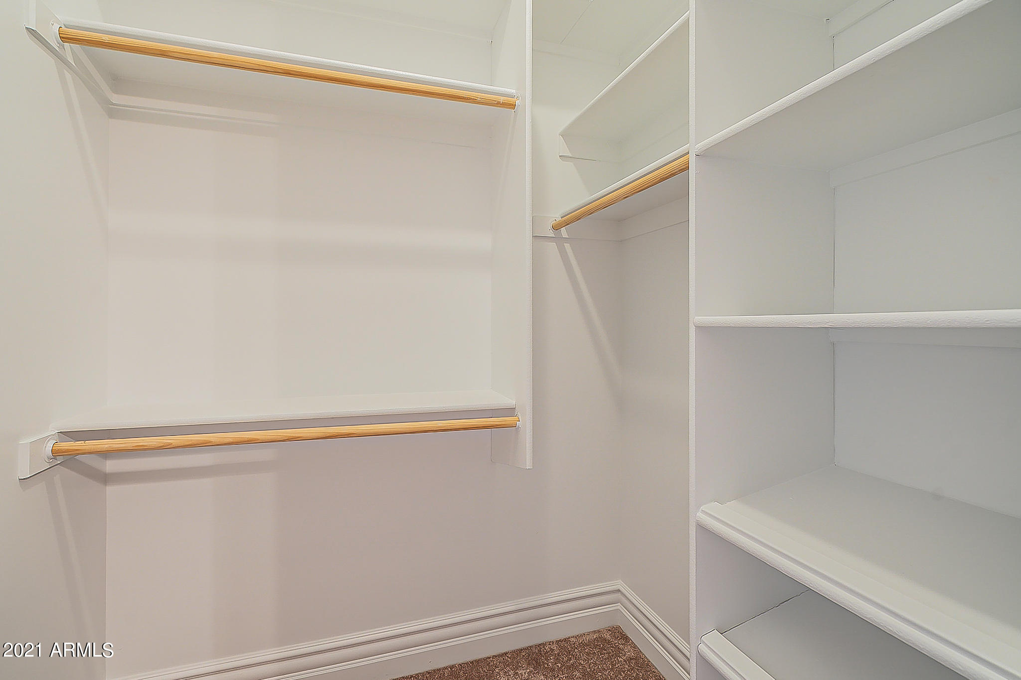 2789 East Ridgewood Lane Gilbert, AZ 85298 - Photo 24 of 60 a view of walk in closet with empty racks
