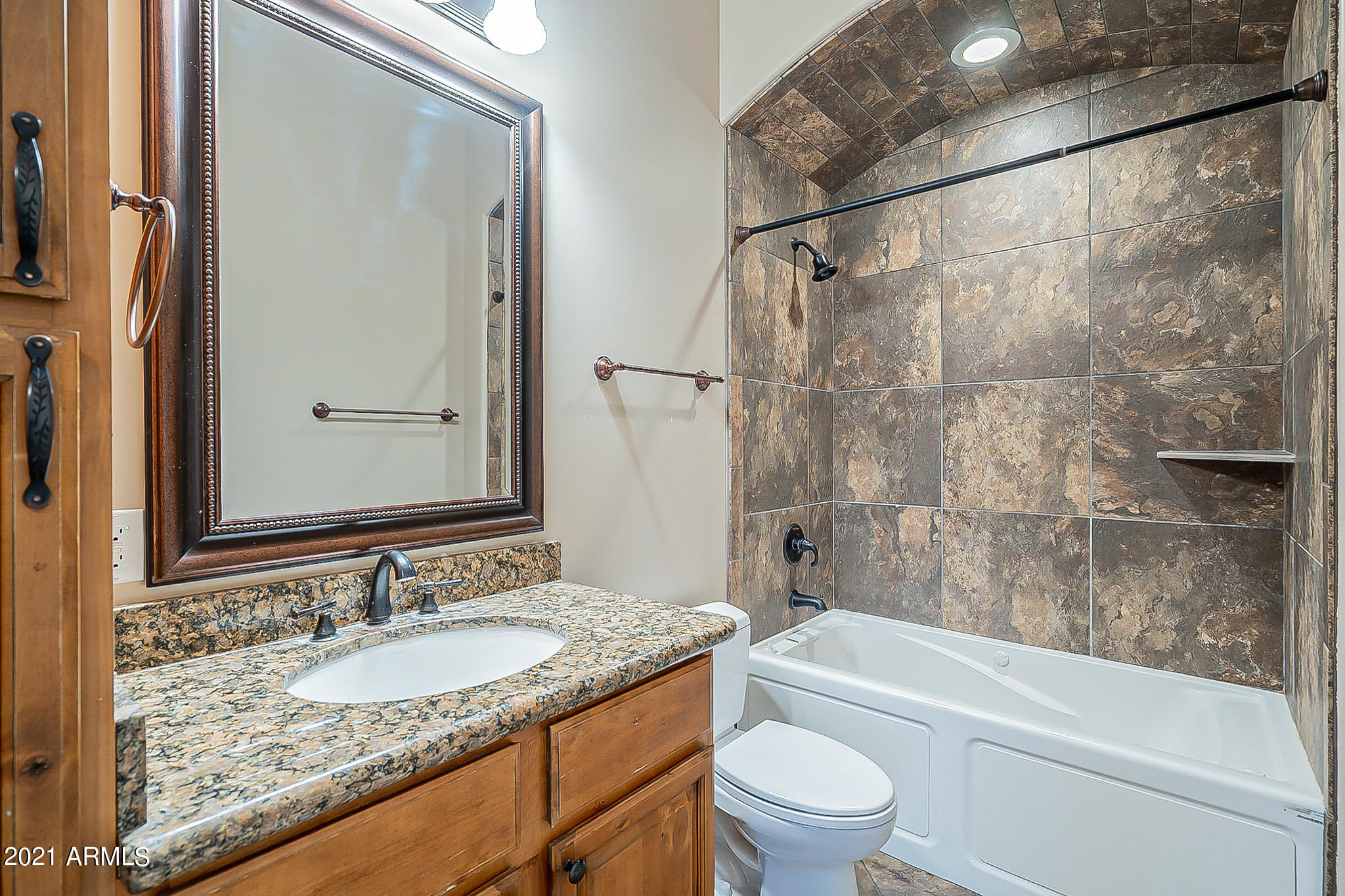 2789 East Ridgewood Lane Gilbert, AZ 85298 - Photo 27 of 60 a bathroom with a granite countertop sink toilet and shower