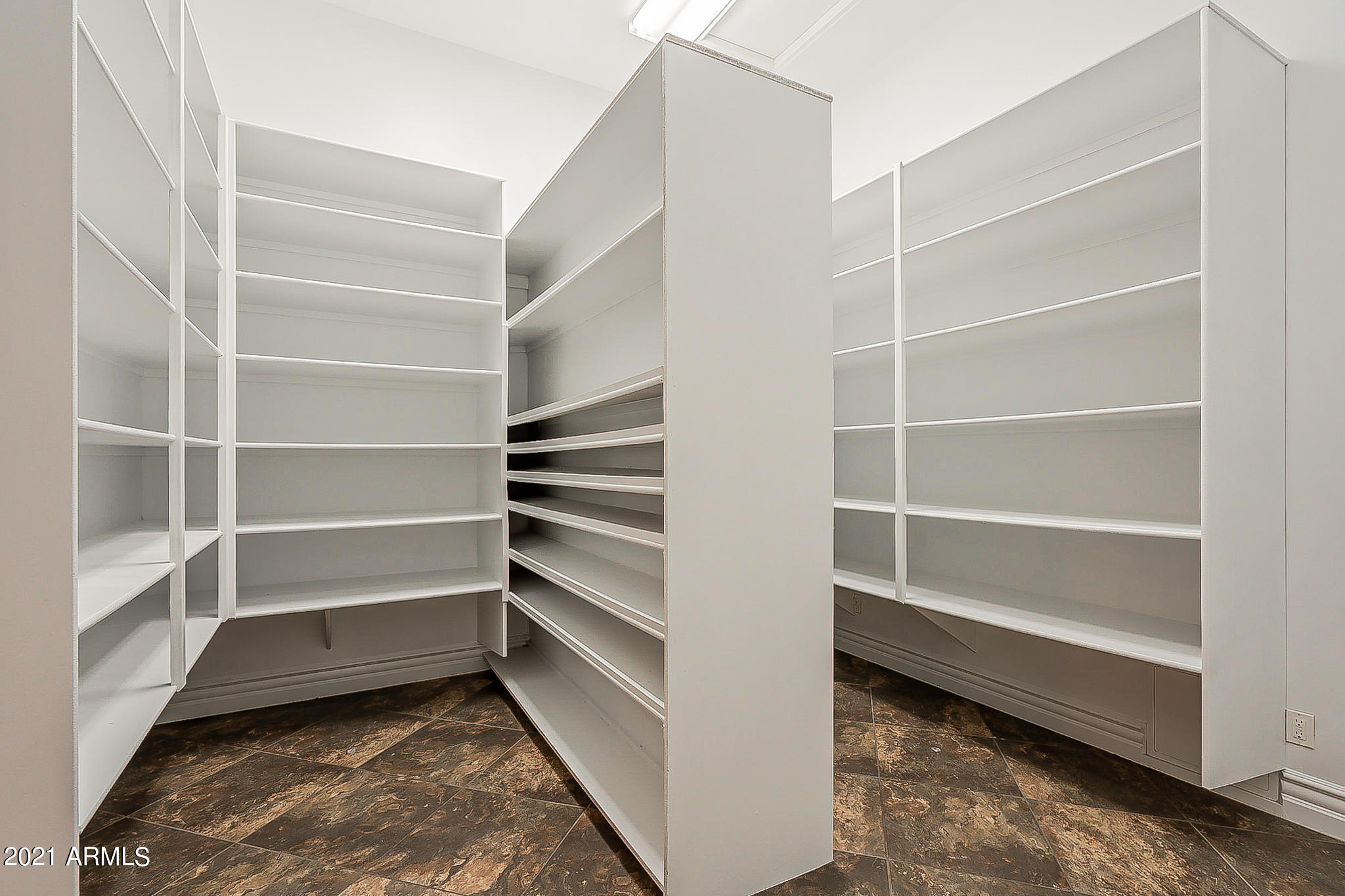 2789 East Ridgewood Lane Gilbert, AZ 85298 - Photo 28 of 60 a view of walk in closet with empty racks