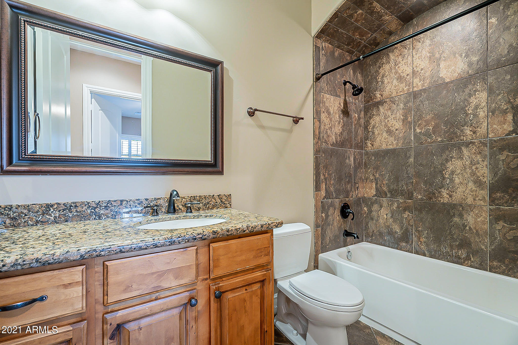 2789 East Ridgewood Lane Gilbert, AZ 85298 - Photo 40 of 60 a bathroom with a granite countertop toilet a sink and a mirror