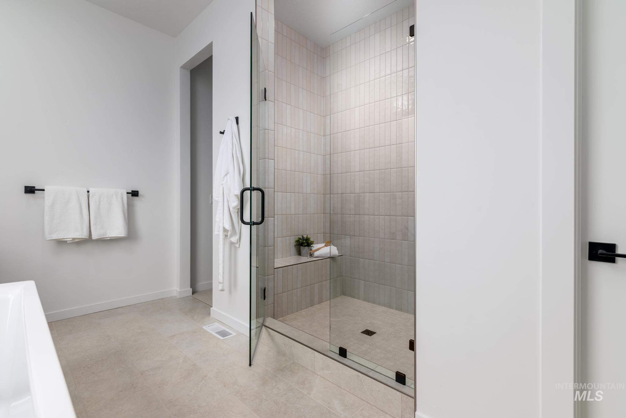 5410 Sparky Avenue Caldwell, ID 83607 - Photo 12 of 23 Full bath featuring a shower stall and light tile patterned floors