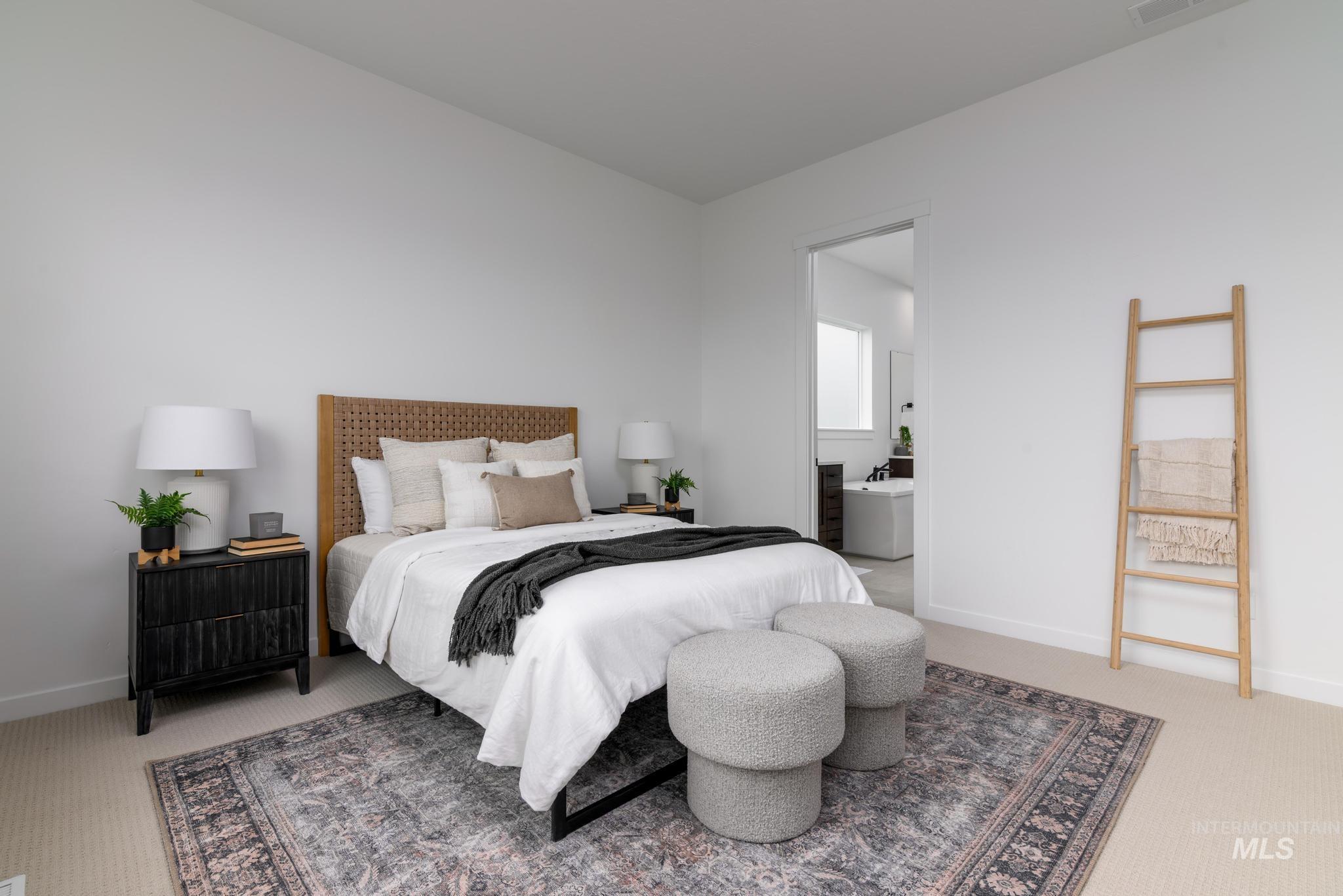 5410 Sparky Avenue Caldwell, ID 83607 - Photo 10 of 23 Bedroom featuring light colored carpet and ensuite bathroom