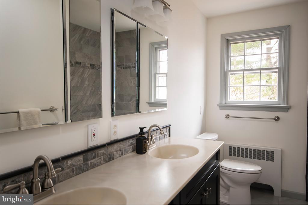 8924 Satyr Hill Road Baltimore, MD 21234 - Photo 21 of 38 Updated hall bath with double sinks and tub/shower