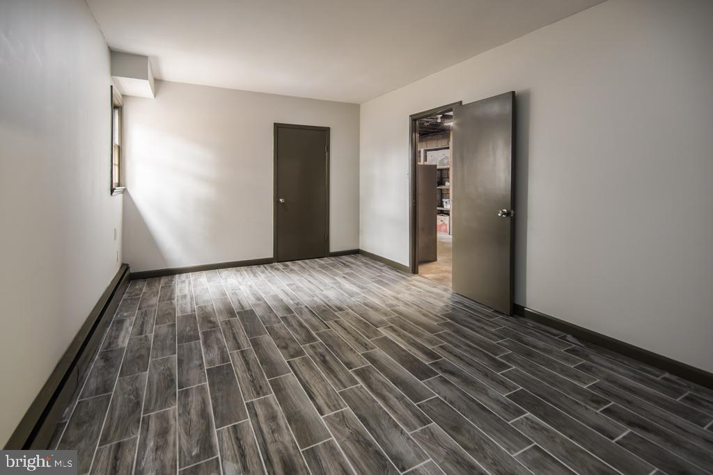 8924 Satyr Hill Road Baltimore, MD 21234 - Photo 30 of 38 Lower level den with beautiful updated tile