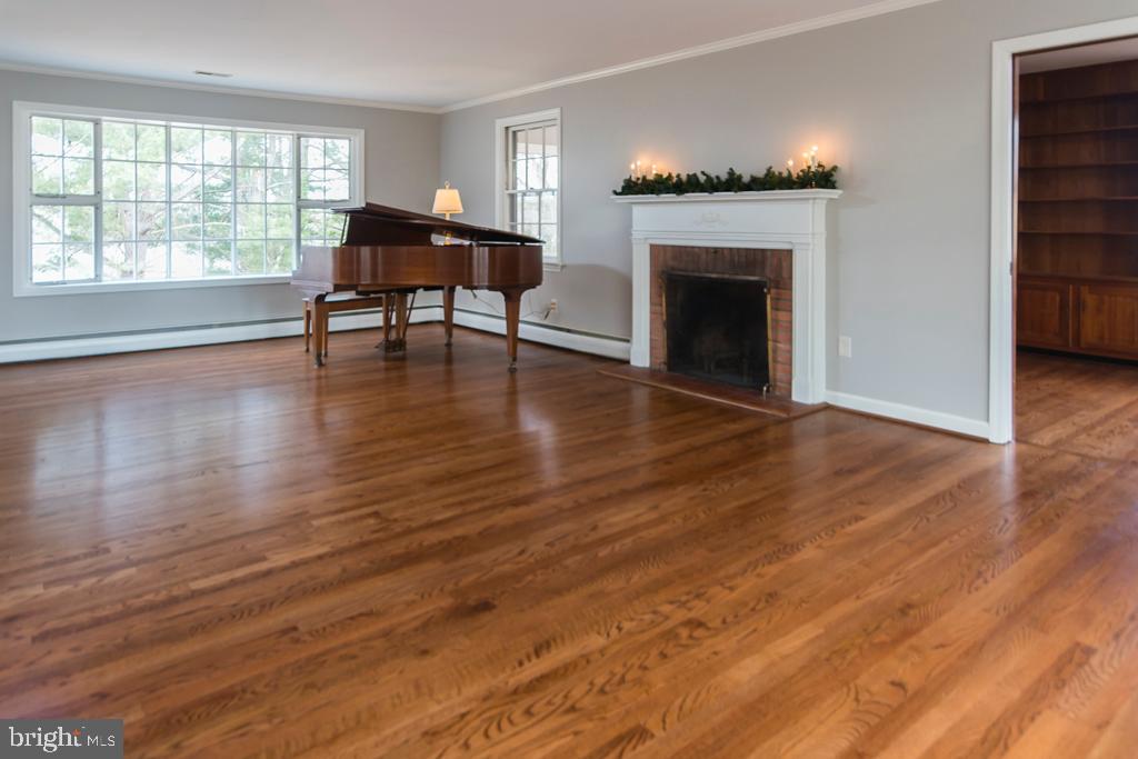 8924 Satyr Hill Road Baltimore, MD 21234 - Photo 4 of 38 Large living room with wood burning fireplace