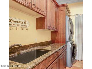 541 Treviso Drive Apollo Beach, FL 33572 - Photo 13 of 29 a kitchen with a refrigerator sink and cabinets