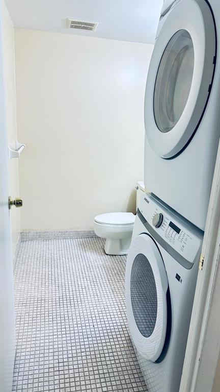 4170 Inverrary Drive, Unit 105 Lauderhill, FL 33319 - Photo 4 of 15 a bathroom with a sink a toilet and a mirror
