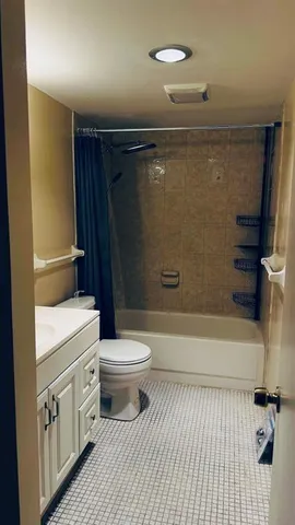 a bathroom with a toilet a sink and bathtub
