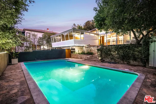 a view of swimming pool with a yard