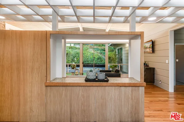 a view of a living room with a large window
