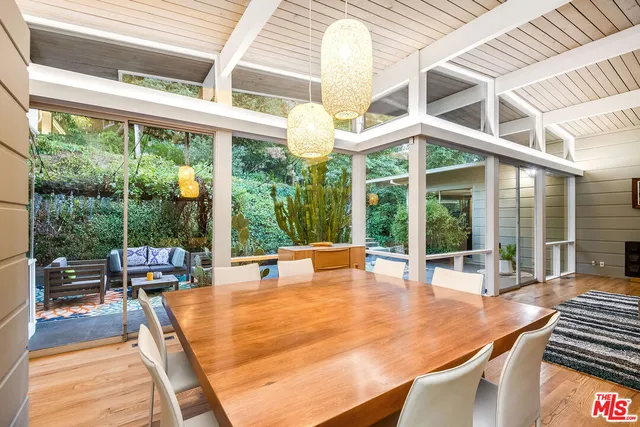 a swimming pool with outdoor seating and yard