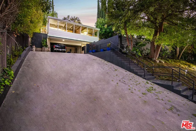 a view of a street with sitting area