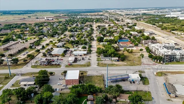 an aerial view of residential houses with outdoor space