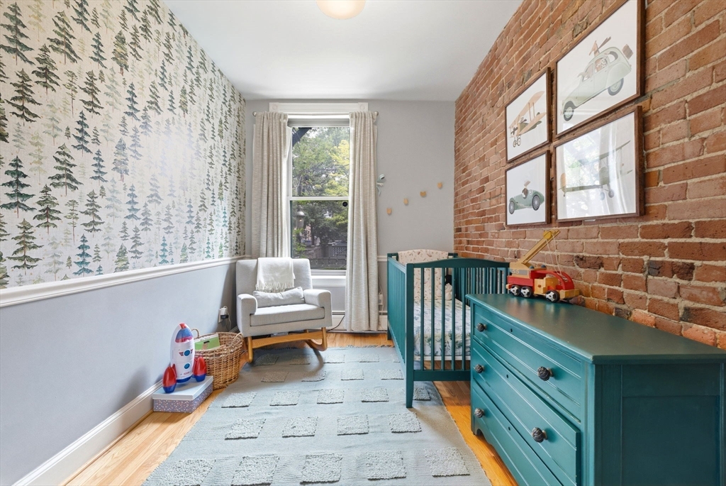 35 High Street, Unit 1 Boston, MA 02129 - Photo 9 of 33 a bedroom with furniture and a window