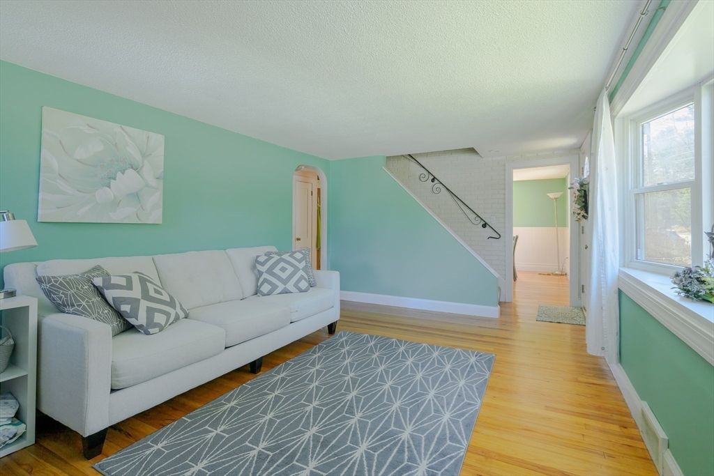 274 Salem Road Billerica, MA 01821 - Photo 8 of 23 a living room with furniture and a rug